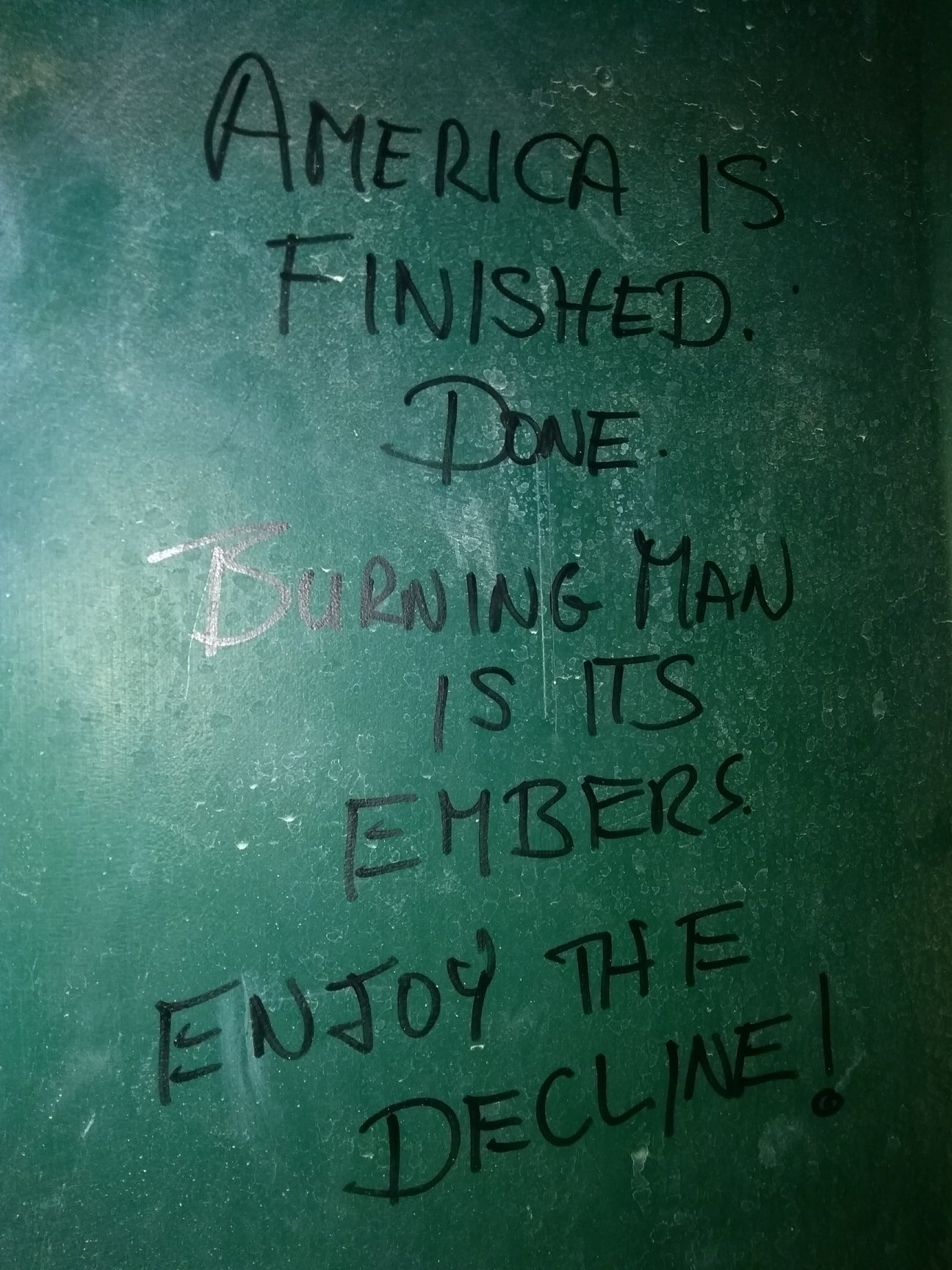 This meme is a humorous image of a blank wall with a single phrase written in marker: "I can explain why the wall is blank. Because I've been explaining it for 40 years."
